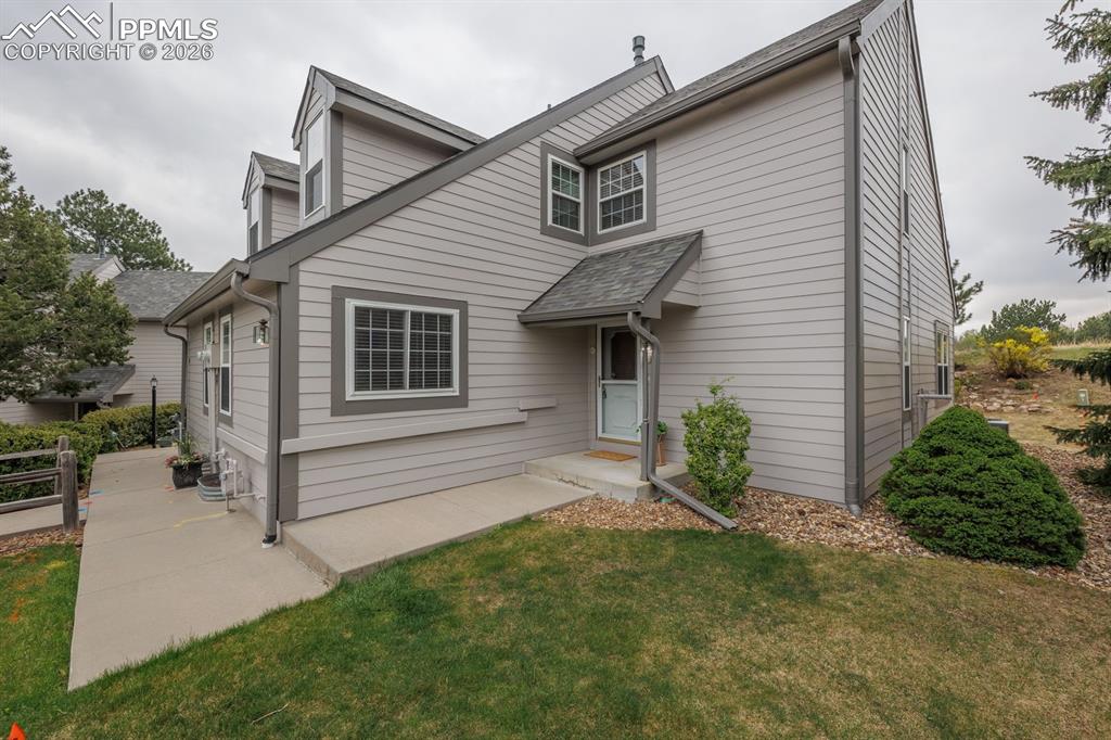 Image 5 of 47: Private grassy area in front, side and rear of home