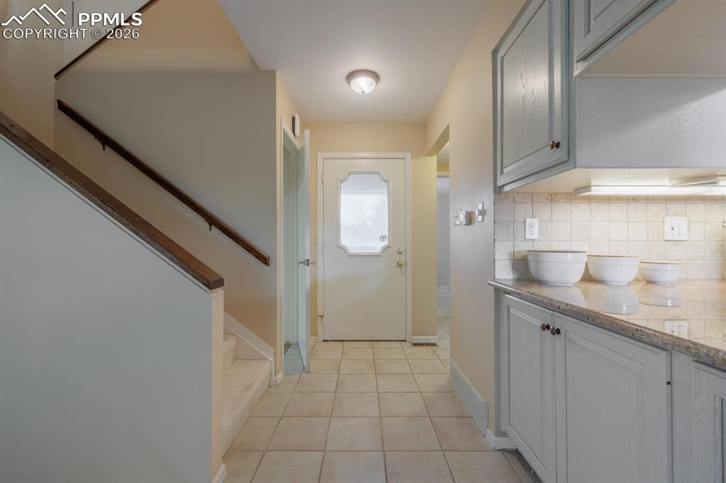 Image 6 of 47: Hall to front bedroom, bath, hall closet and pantry closet