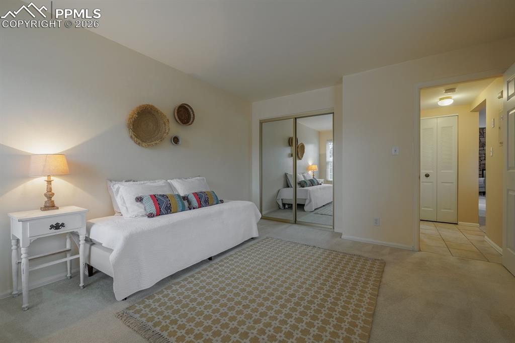 Image 7 of 47: Sunlit bedroom off entry hall