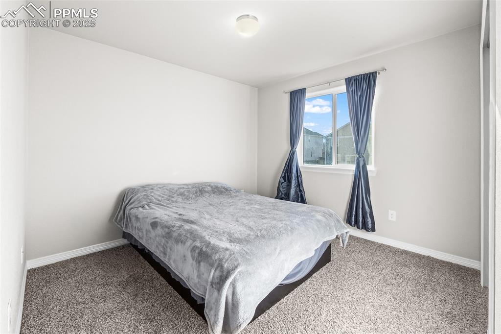 Image 47 of 48: Bedroom with carpet