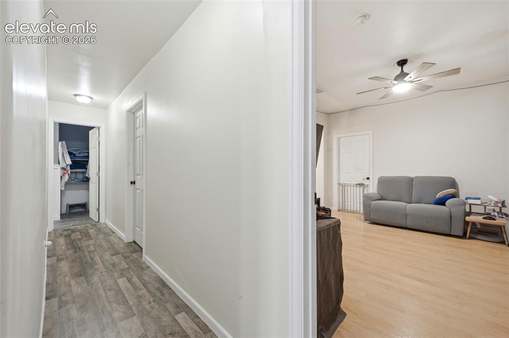 Image 33 of 49: Interior hallway featuring wood-finish flooring and flush-mount lighting