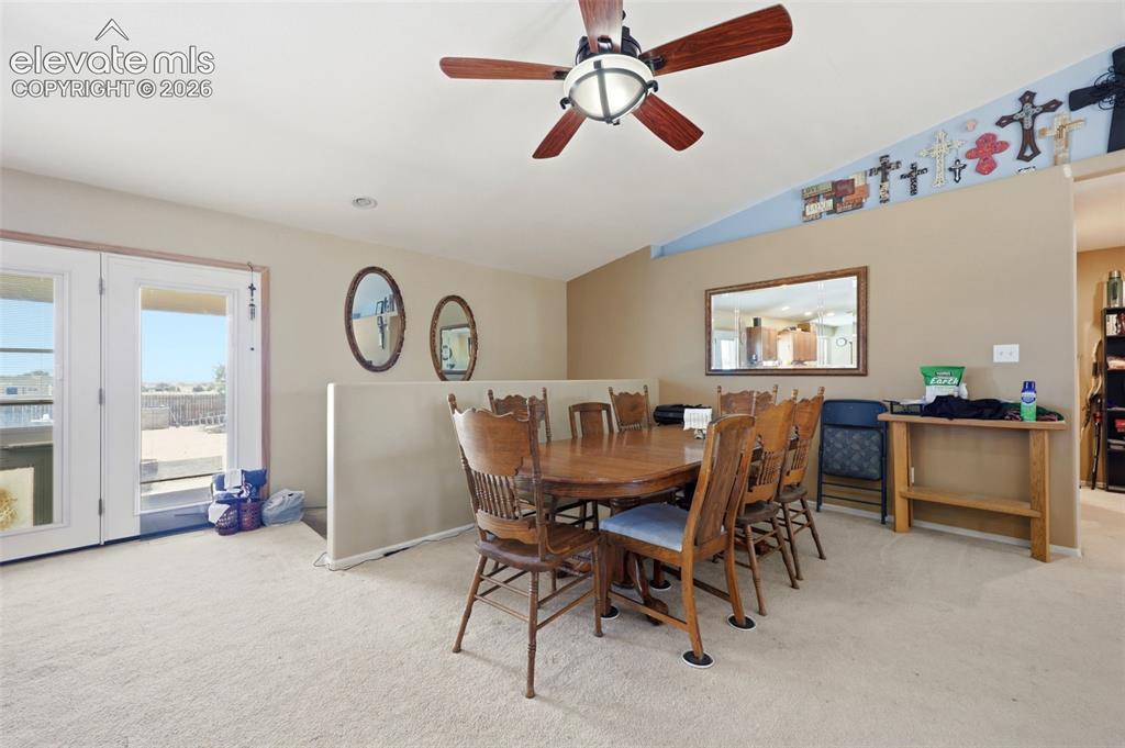 Image 6 of 49: Carpeted interior space featuring a ceiling fan with integrated lighting, a