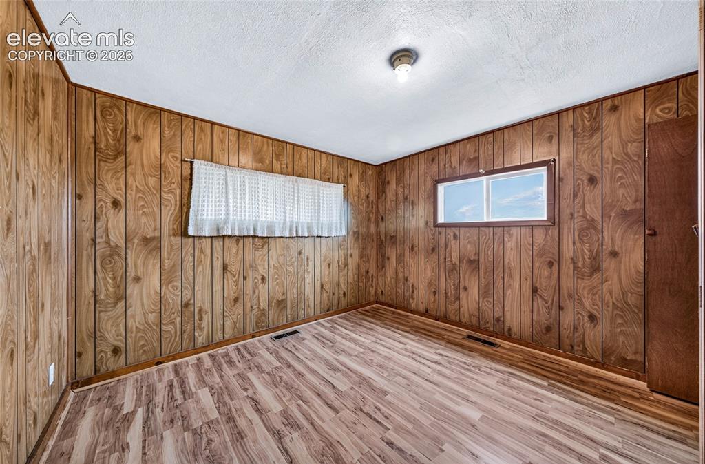 Image 19 of 45: Primary bedroom with walk-through closet