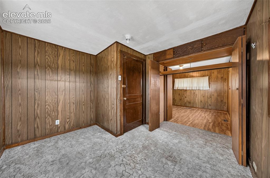 Image 21 of 45: Textured carpeting in a neutral tone
