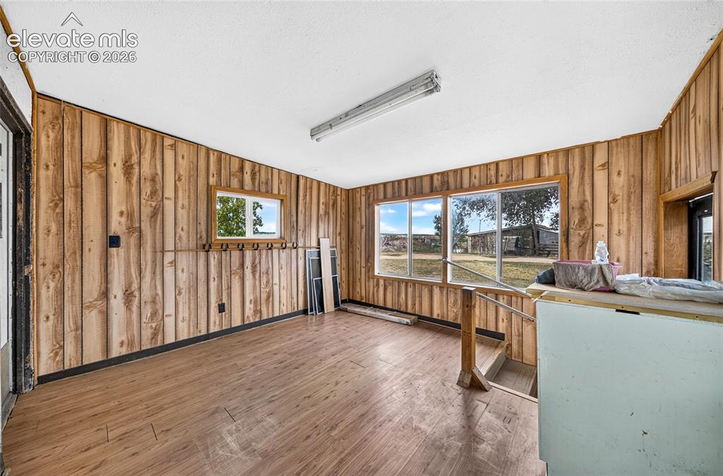 Image 22 of 45: Enclosed back porch