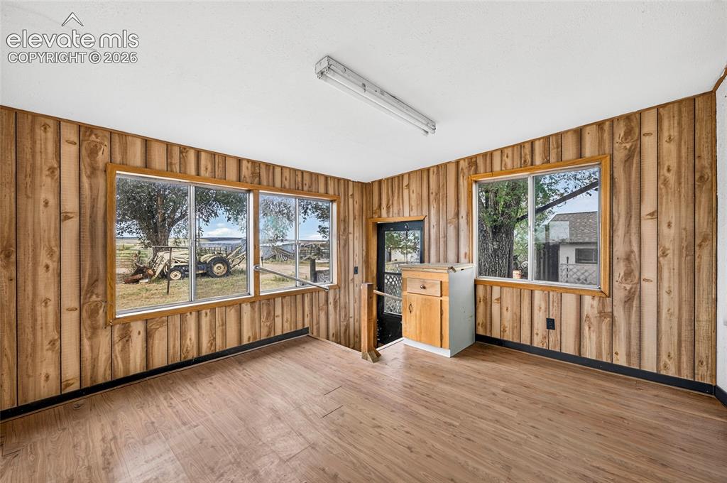 Image 23 of 45: Enclosed back porch