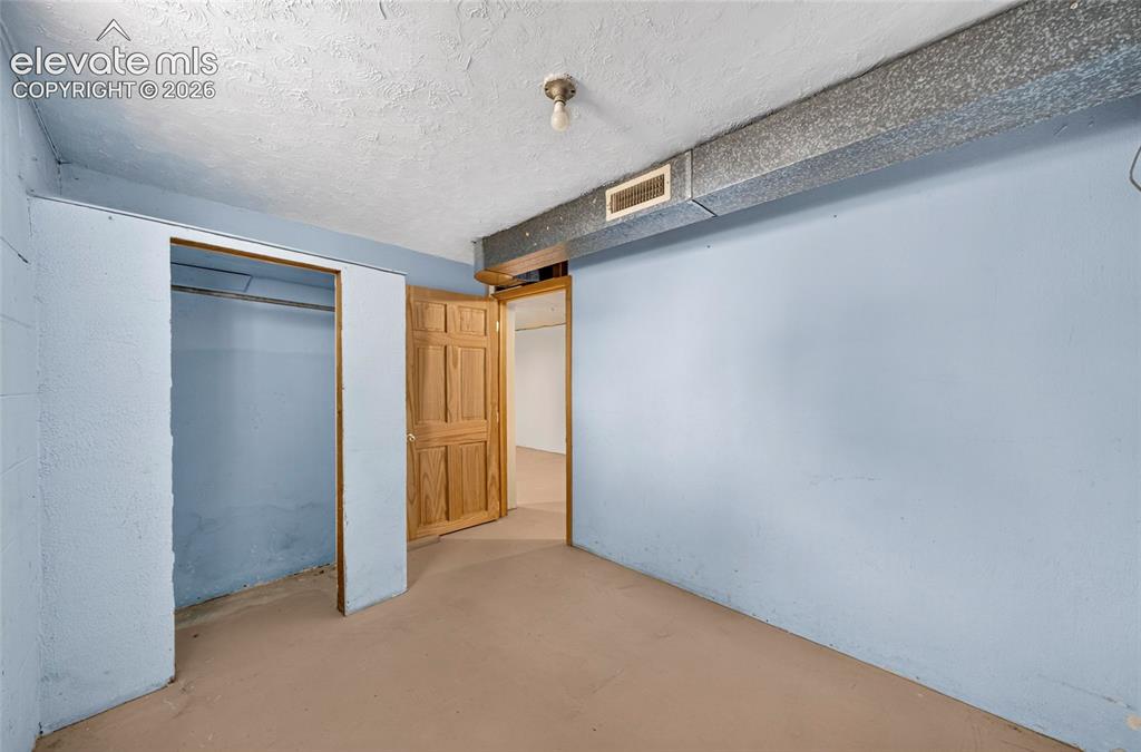 Image 26 of 45: Interior room with light-colored walls and a light-colored floor