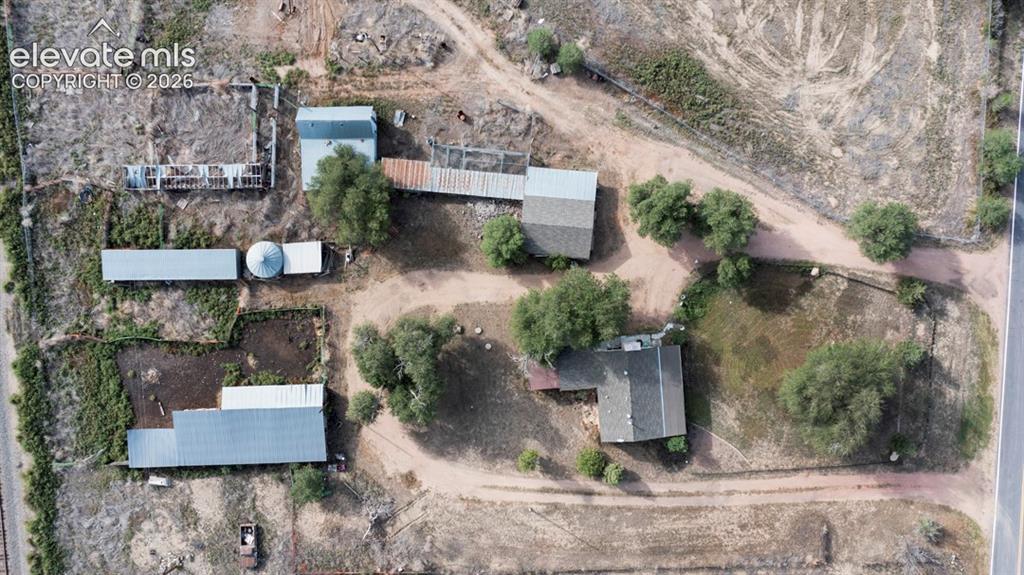 Image 39 of 45: Multiple structures on expansive lot, including a primary residence with a