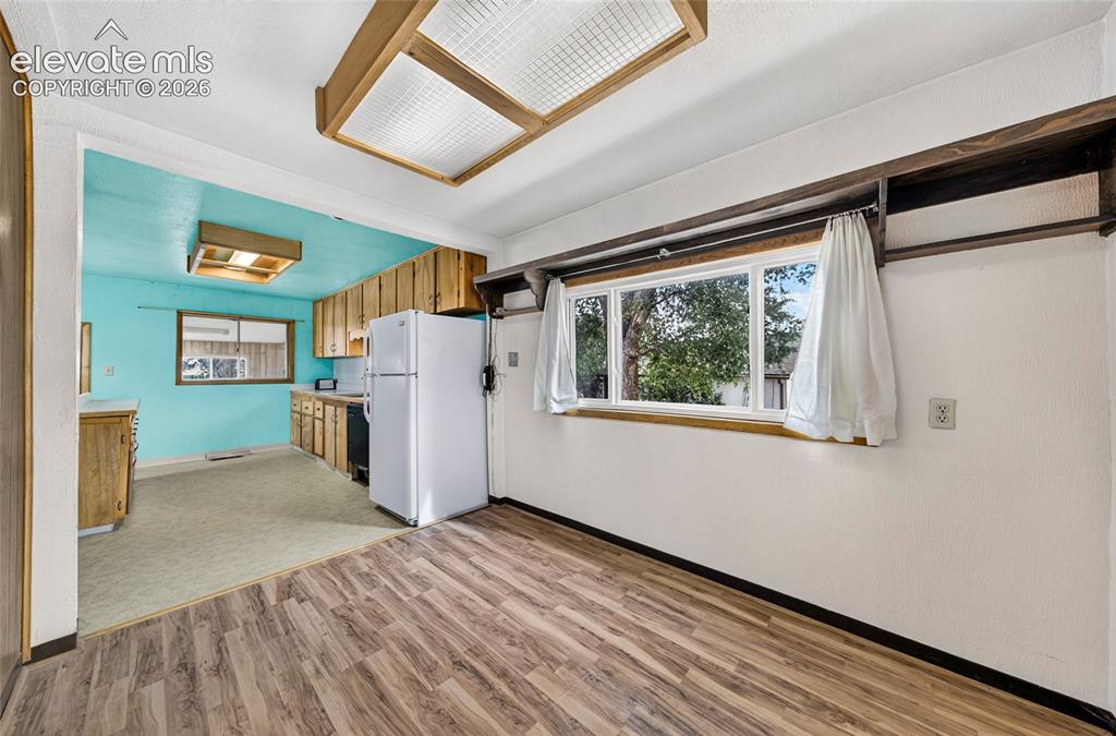 Image 9 of 45: Dining area between living room and kitchen