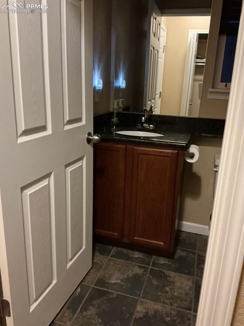 Image 13 of 29: Powder room off kitchen area