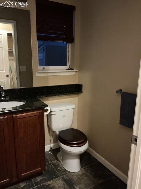 Image 14 of 29: Powder room off kitchen area