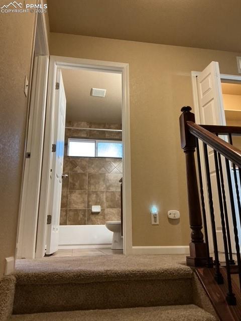 Image 15 of 29: Stairs leading to main bath laundry and bedrooms