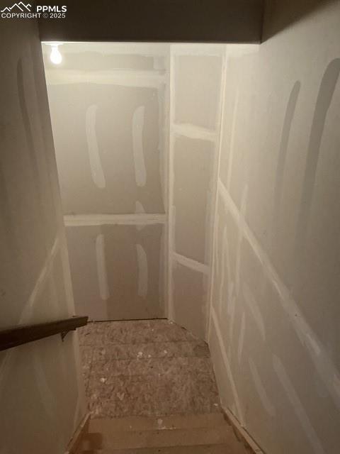 Image 28 of 29: Stairs to basement from kitchen area