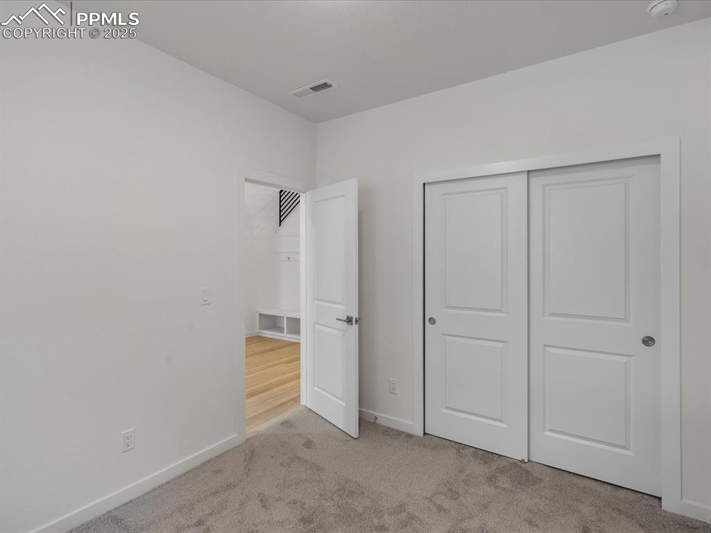 Image 31 of 32: Unfurnished bedroom featuring carpet floors and a closet