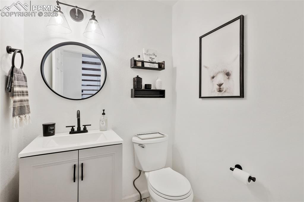 Image 12 of 27: Bathroom featuring vanity and toilet