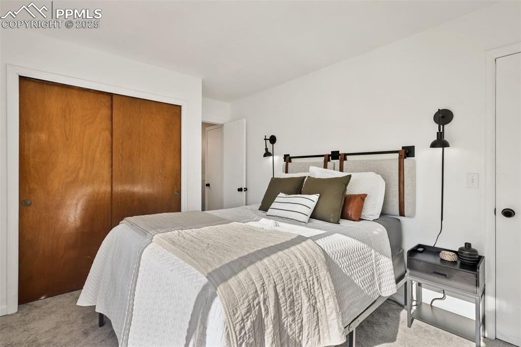 Image 20 of 27: Bedroom with carpet flooring and a closet