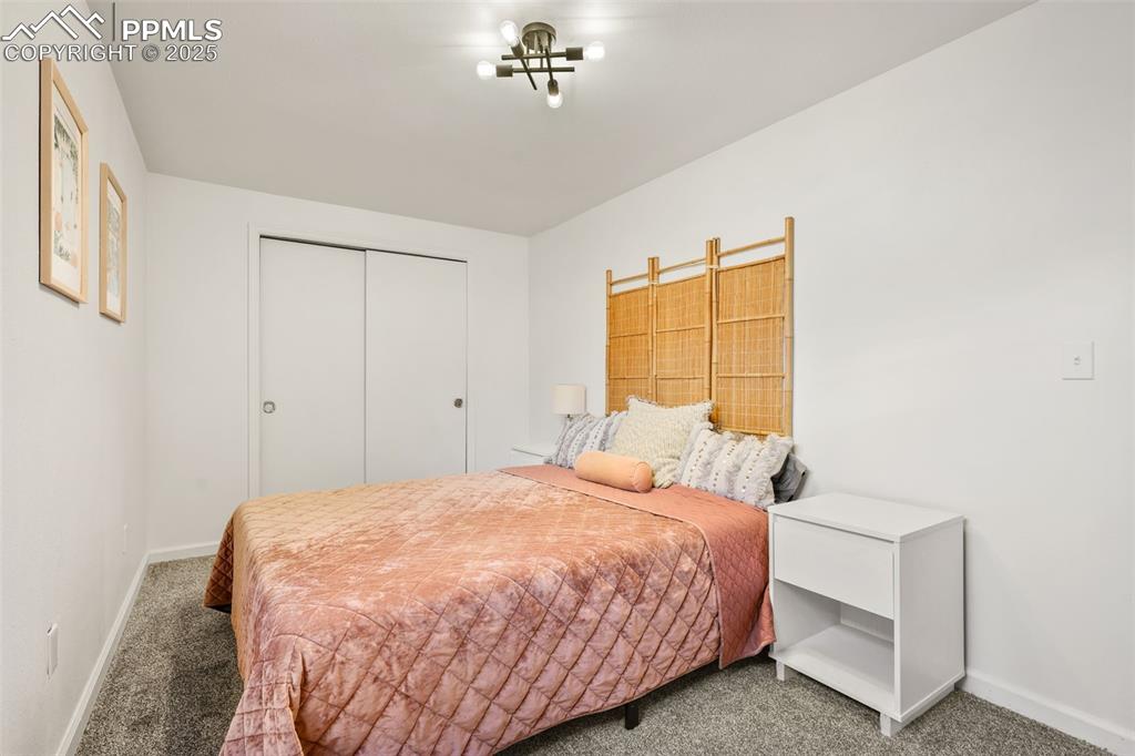 Image 23 of 27: Carpeted bedroom featuring a closet and baseboards