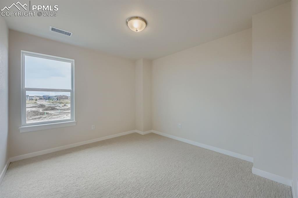 Image 18 of 28: Unfurnished room featuring light colored carpet