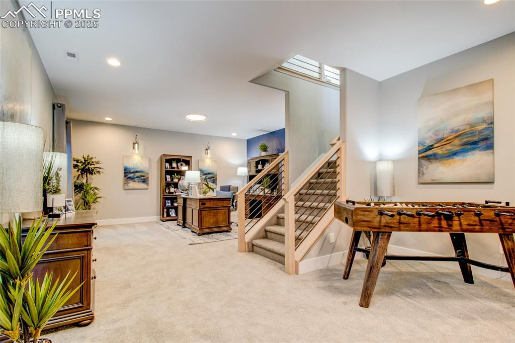 Image 24 of 30: Stairs featuring recessed lighting and carpet floors