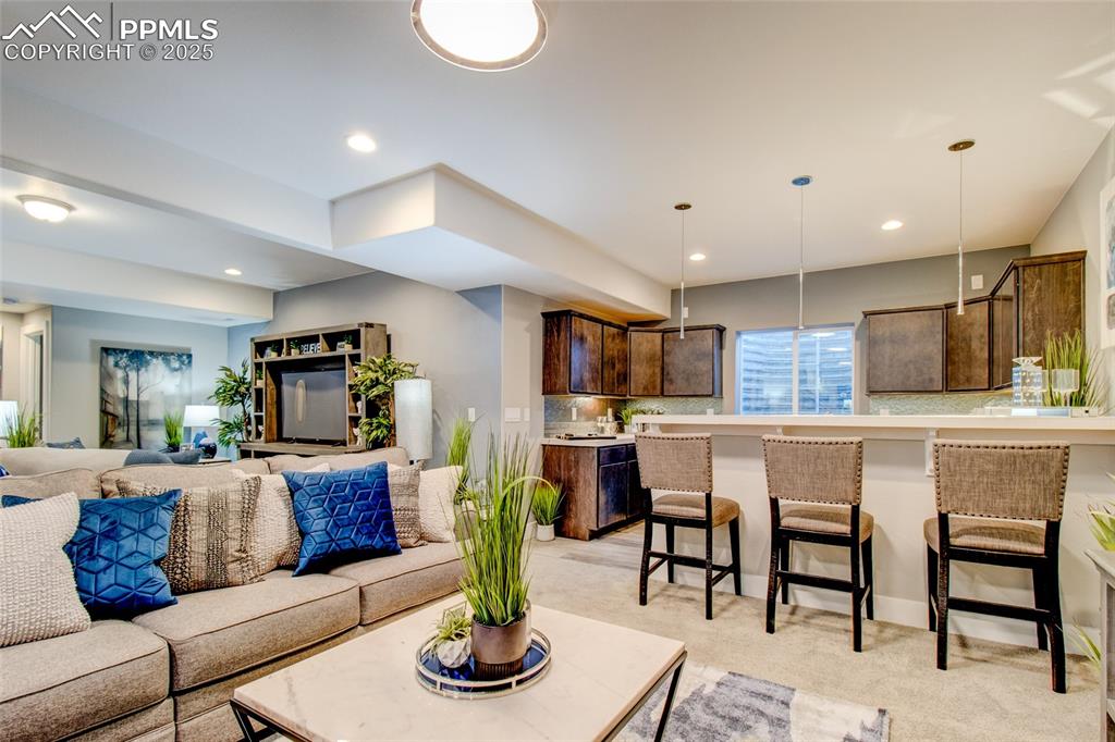 Image 26 of 30: Living room with recessed lighting