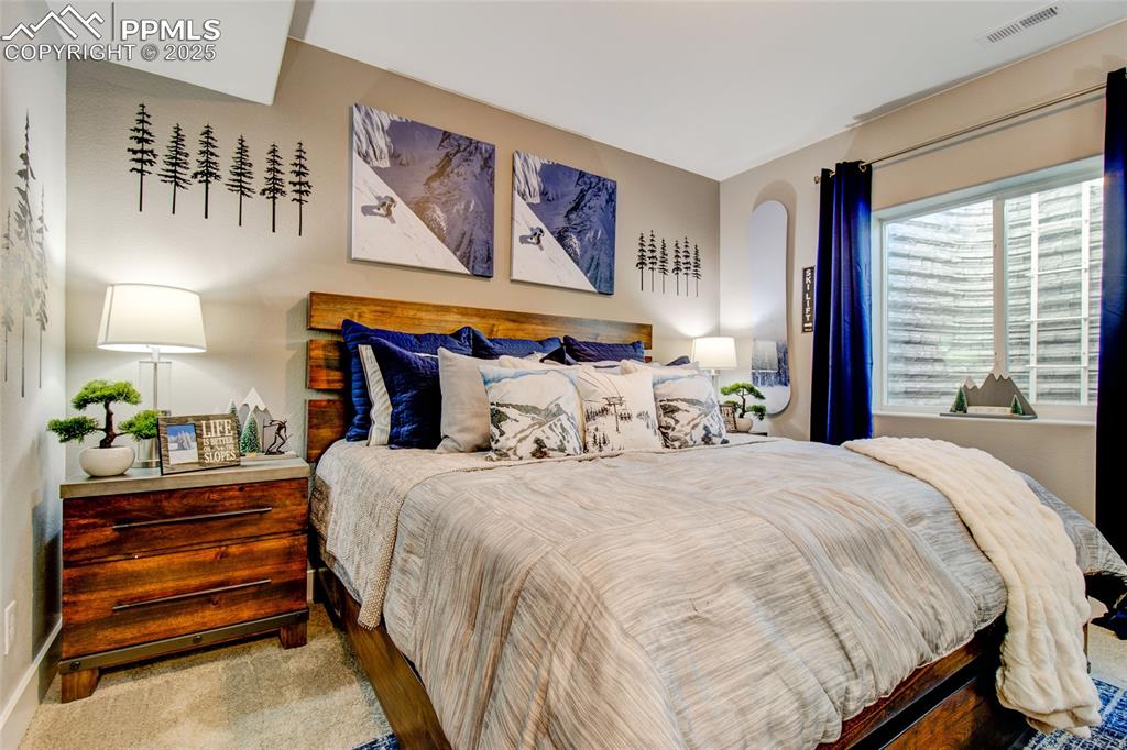 Image 29 of 30: View of carpeted bedroom