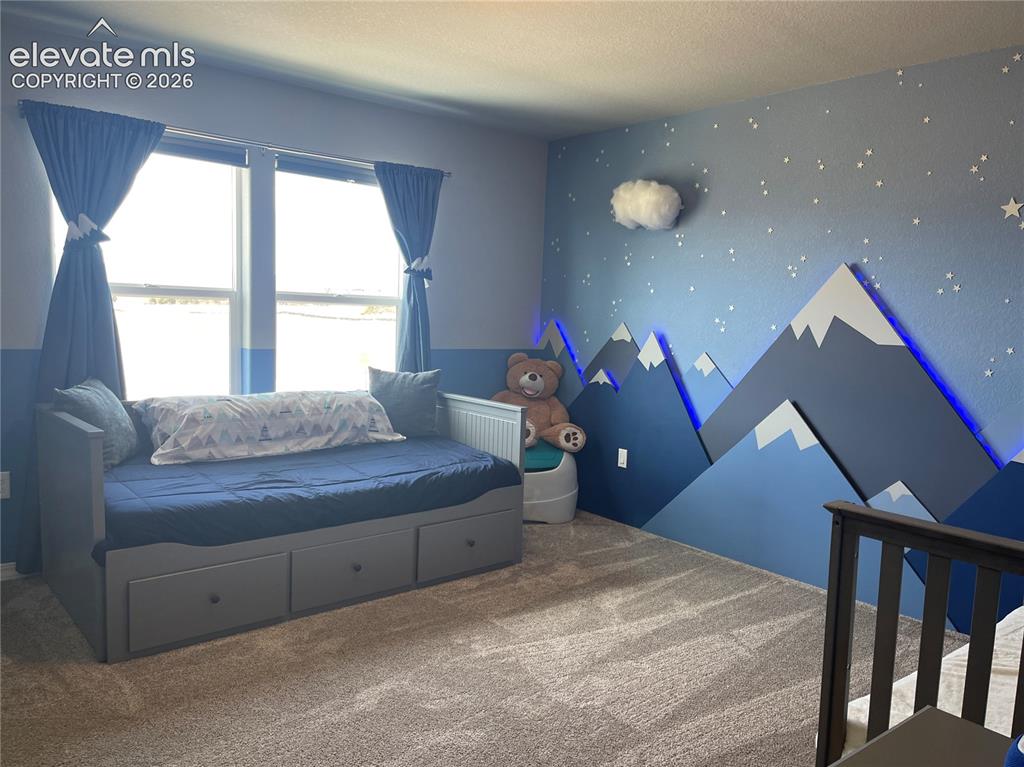 Image 11 of 25: Bedroom featuring carpet flooring