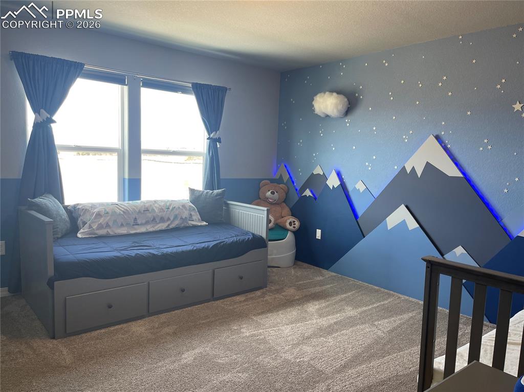 Image 12 of 26: Bedroom featuring carpet flooring