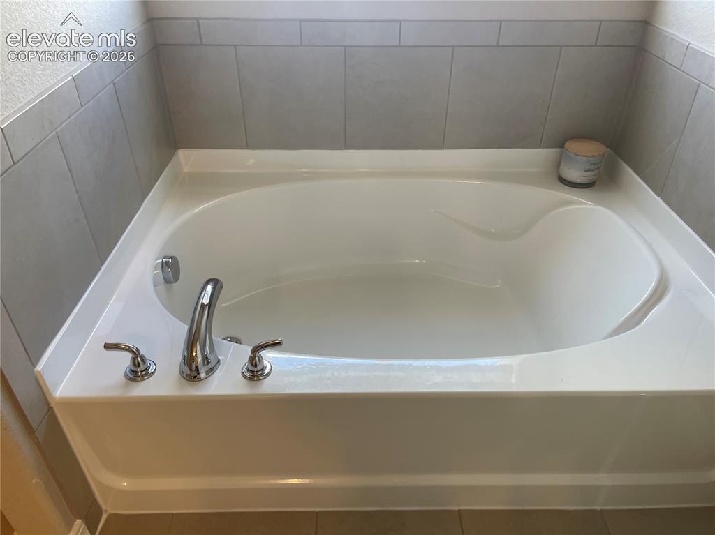 Image 15 of 25: Bathroom with a garden tub
