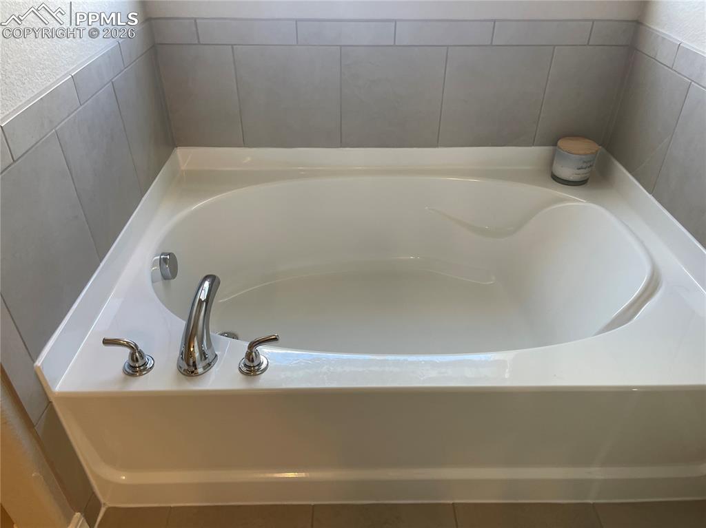 Image 16 of 26: Bathroom with a garden tub