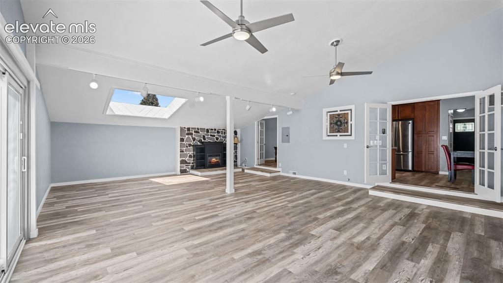 Image 16 of 39: Laundry area featuring white cabinetry, a utility sink, and tile flooring