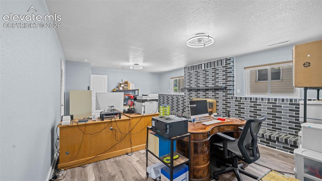 Image 22 of 39: Bedroom featuring wood-finish flooring, a ceiling fan with integrated light