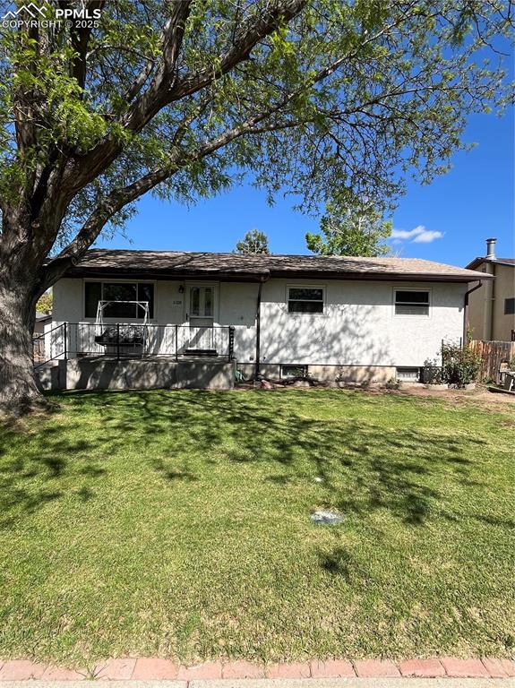 Image 2 of 29: Rear view of property with a lawn and a porch