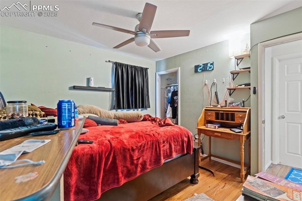 Image 14 of 25: Bedroom featuring light wood finished floors, a closet, and ceiling fan