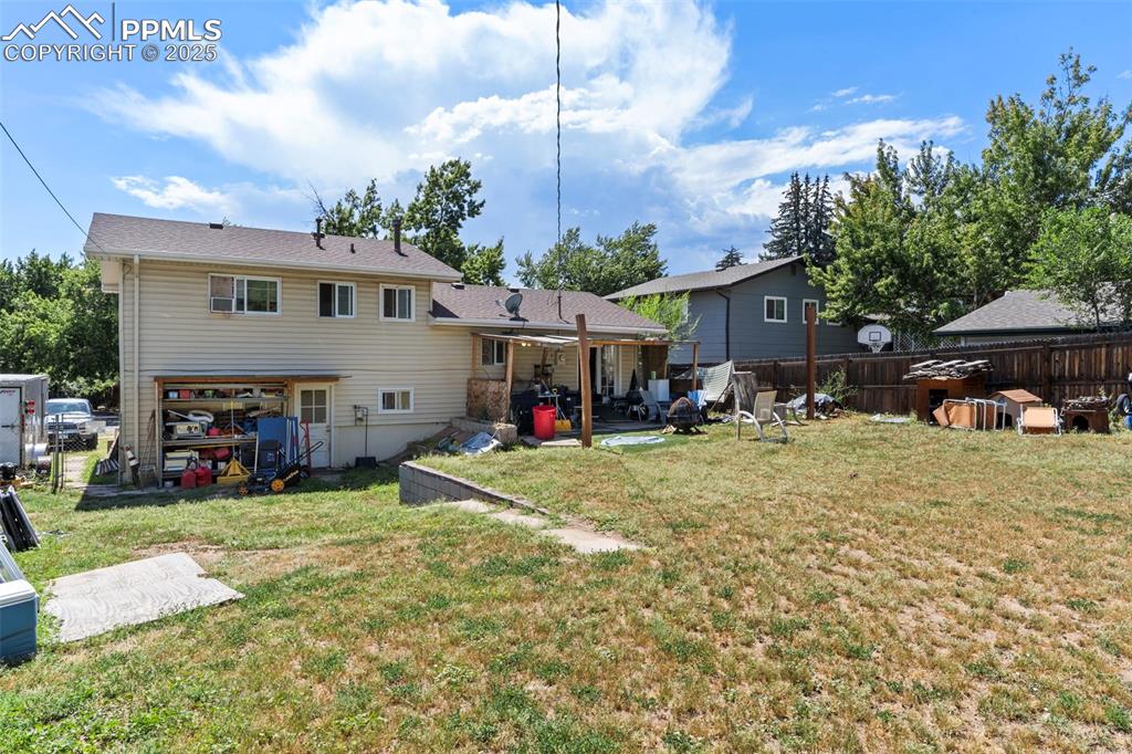 Image 23 of 25: Back of property featuring a patio