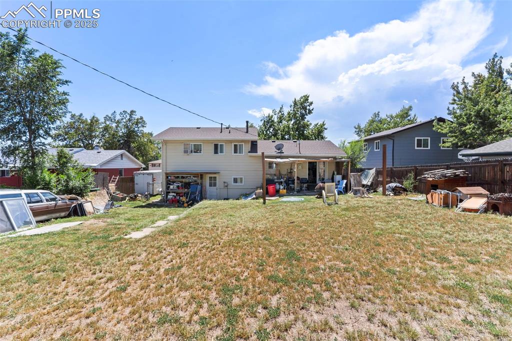 Image 24 of 25: Back of property featuring a patio