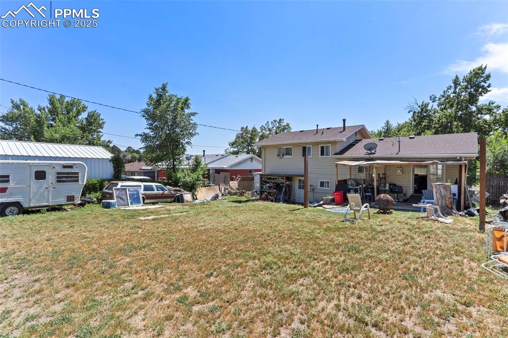 Image 25 of 25: View of yard with a patio and an outdoor structure