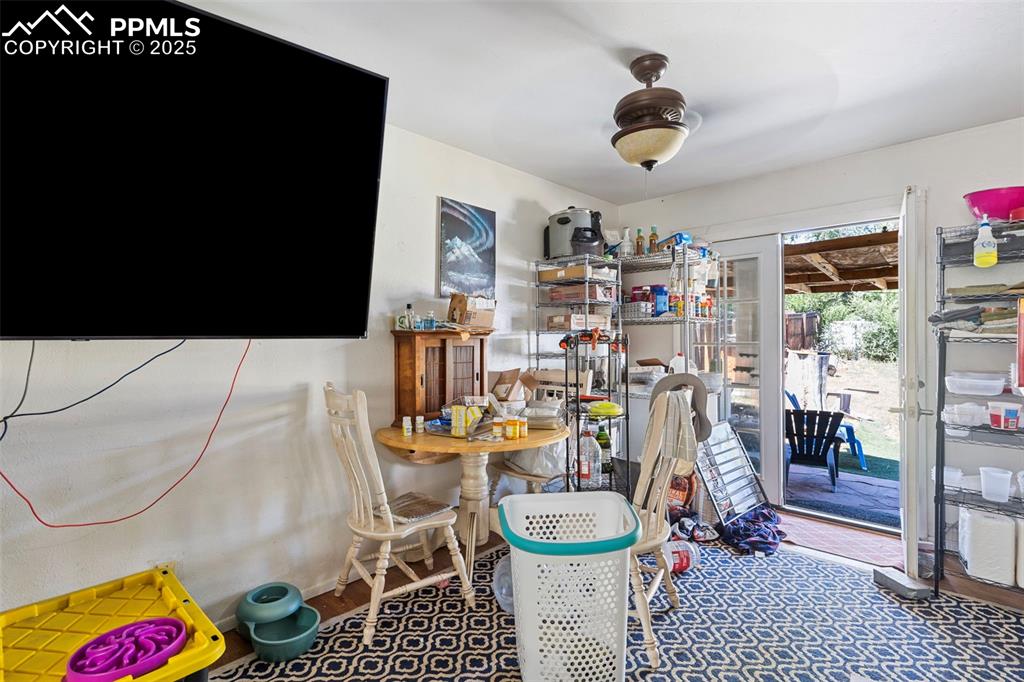 Image 9 of 25: Dining area with a ceiling fan