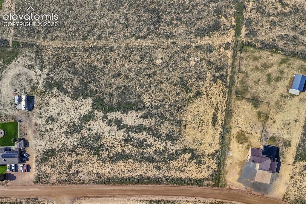 Image 48 of 50: Expansive parcel of land featuring native vegetation, natural terrain, and 