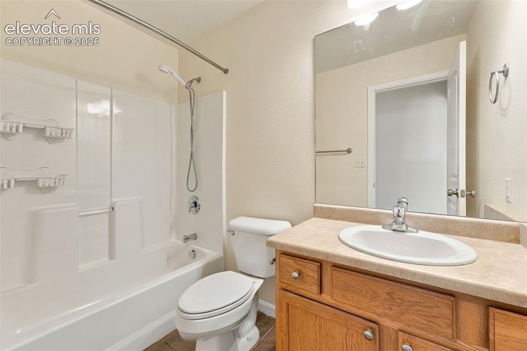 Image 6 of 50: Bathroom featuring a shower and tub combination with a molded surround, woo