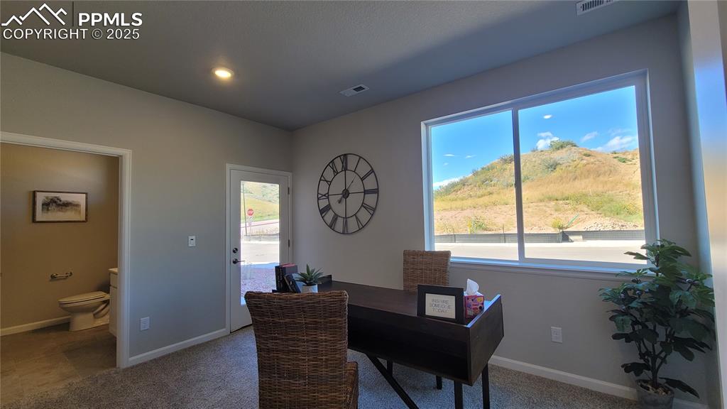 Image 27 of 31: Main Level Bedroom with ensuite and private patio!