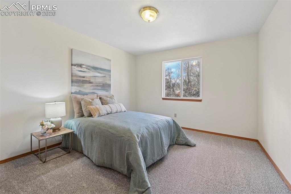 Image 23 of 42: Second bedroom on main level