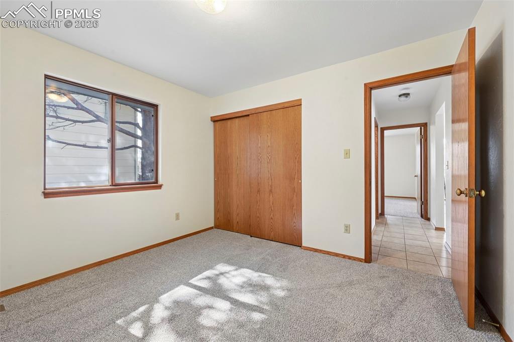 Image 27 of 42: Third bedroom on main level