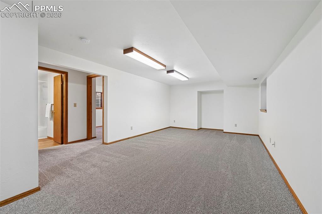 Image 28 of 42: Downstairs living/rec space