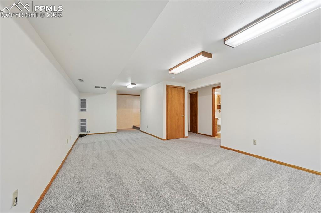 Image 29 of 42: Downstairs living/rec space