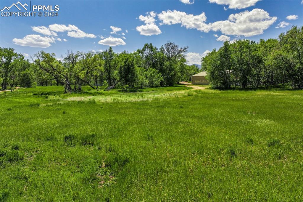 Image 2 of 5: View of yard featuring a rural view