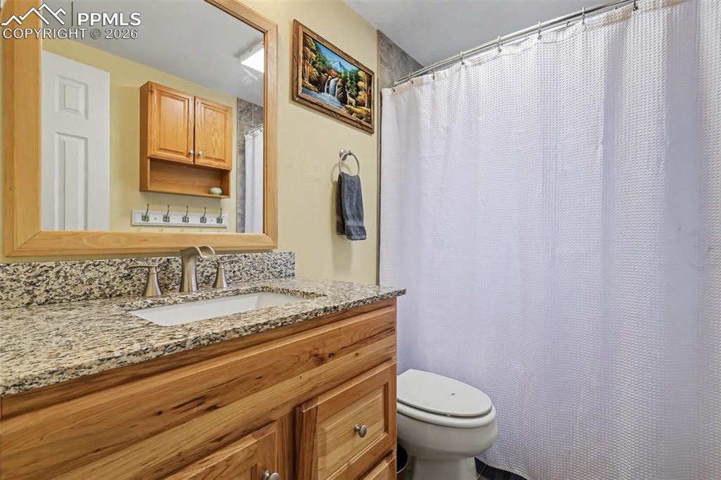 Image 22 of 33: Full bathroom with vanity and a shower/tub