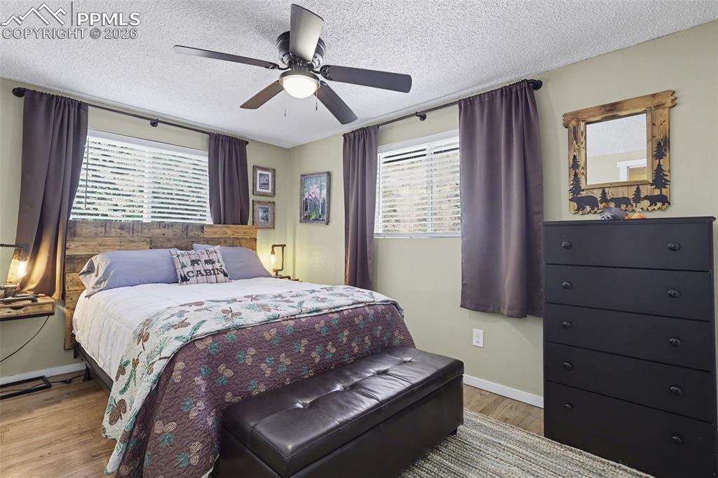 Image 23 of 33: Second bedroom with hardwood flooring