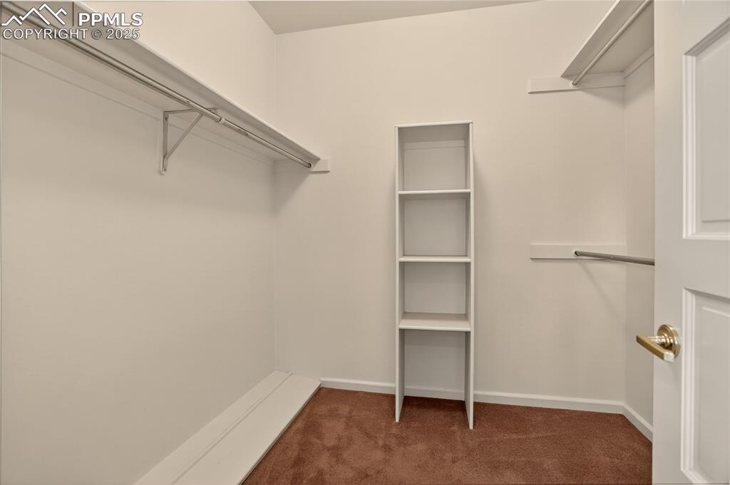 Image 23 of 41: Primary walk in closet,
2 other closets