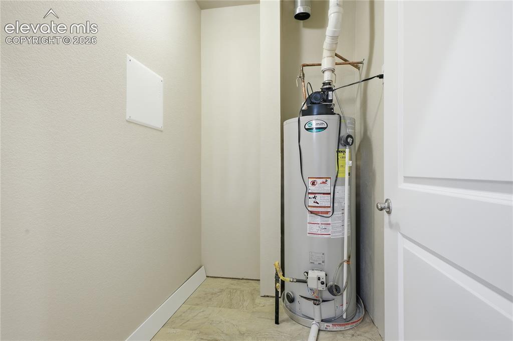 Image 24 of 28: Water heater installation within a dedicated utility space