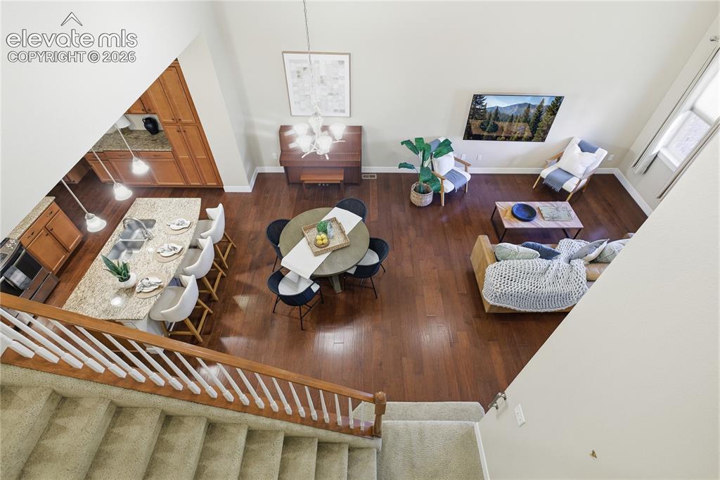 Image 27 of 28: Hardwood flooring, kitchen island with seating, built-in cabinetry, high ce